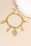 Bracelet chaîne breloques coquillages marins doré
