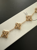 Bracelet chaîne dorée fleurs quatre pétales strass