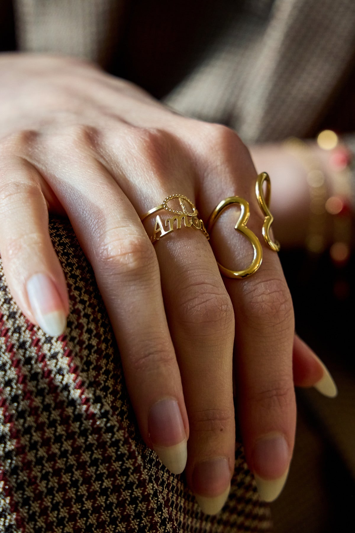 Bague ouverte dorée double anneau Amour et maille marine
