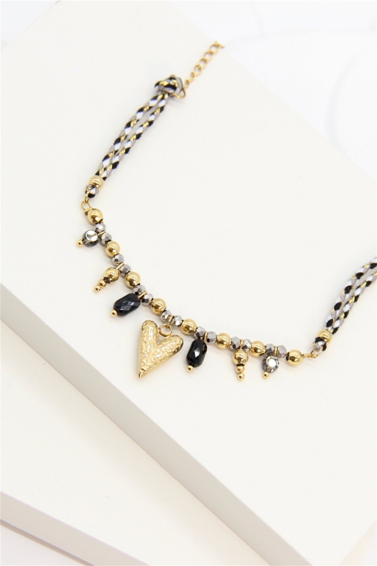 Bracelet tressé noir et doré perles cristal et charm cœur doré