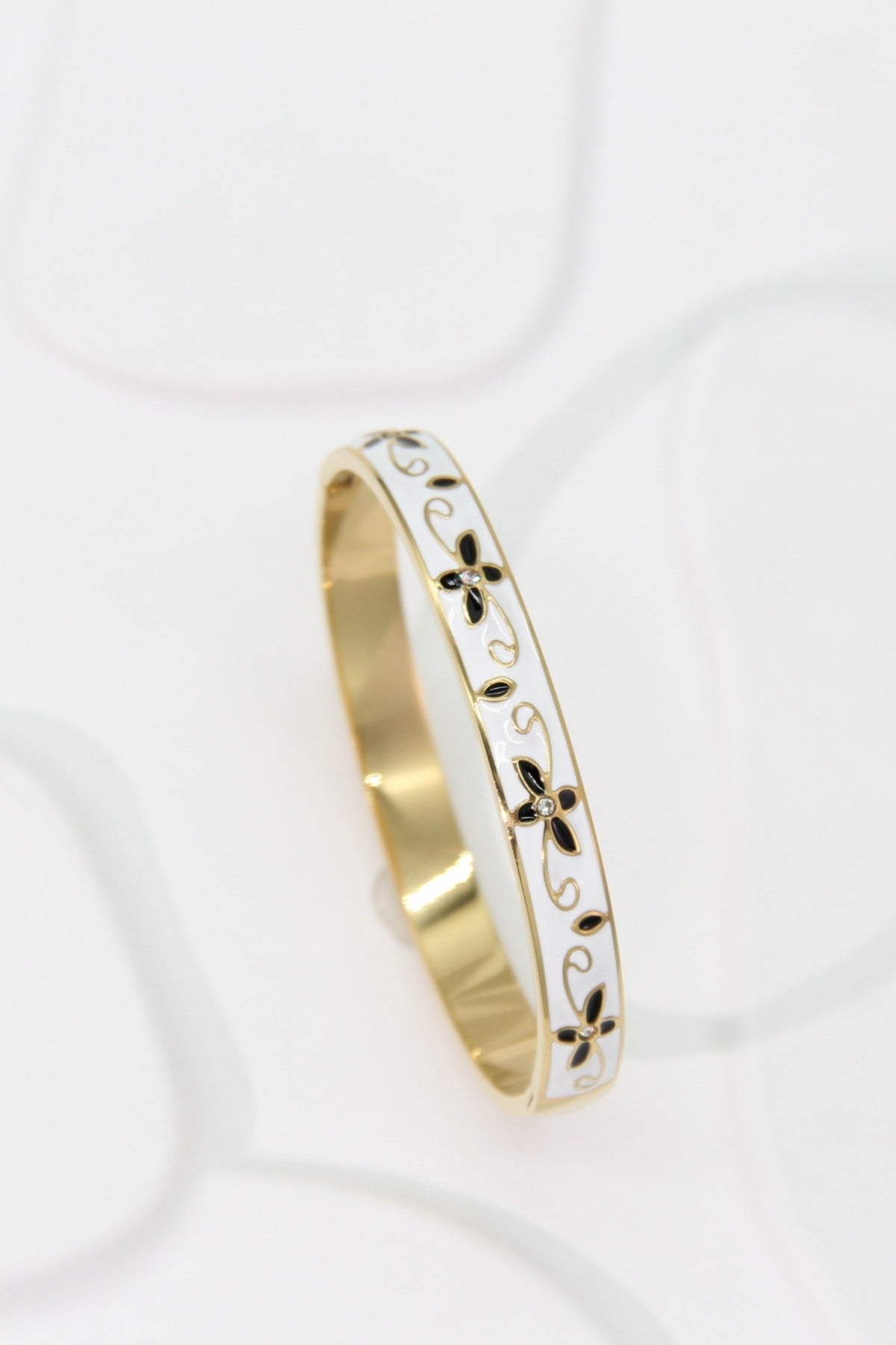 Bracelet jonc doré blanc motif fleurs noires et arabesques