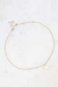Collier chaîne dorée à pastilles et pendentif perle d'eau douce