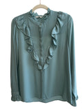 ReTrend Formula Joven light blue flowing blouse with ruffled high neck, ruffled front, and ruffled cuffs. Size 40.