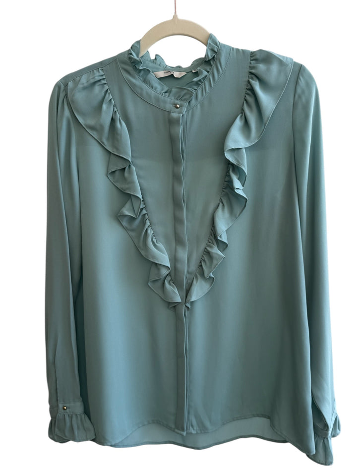 ReTrend Formula Joven light blue flowing blouse with ruffled high neck, ruffled front, and ruffled cuffs. Size 40.