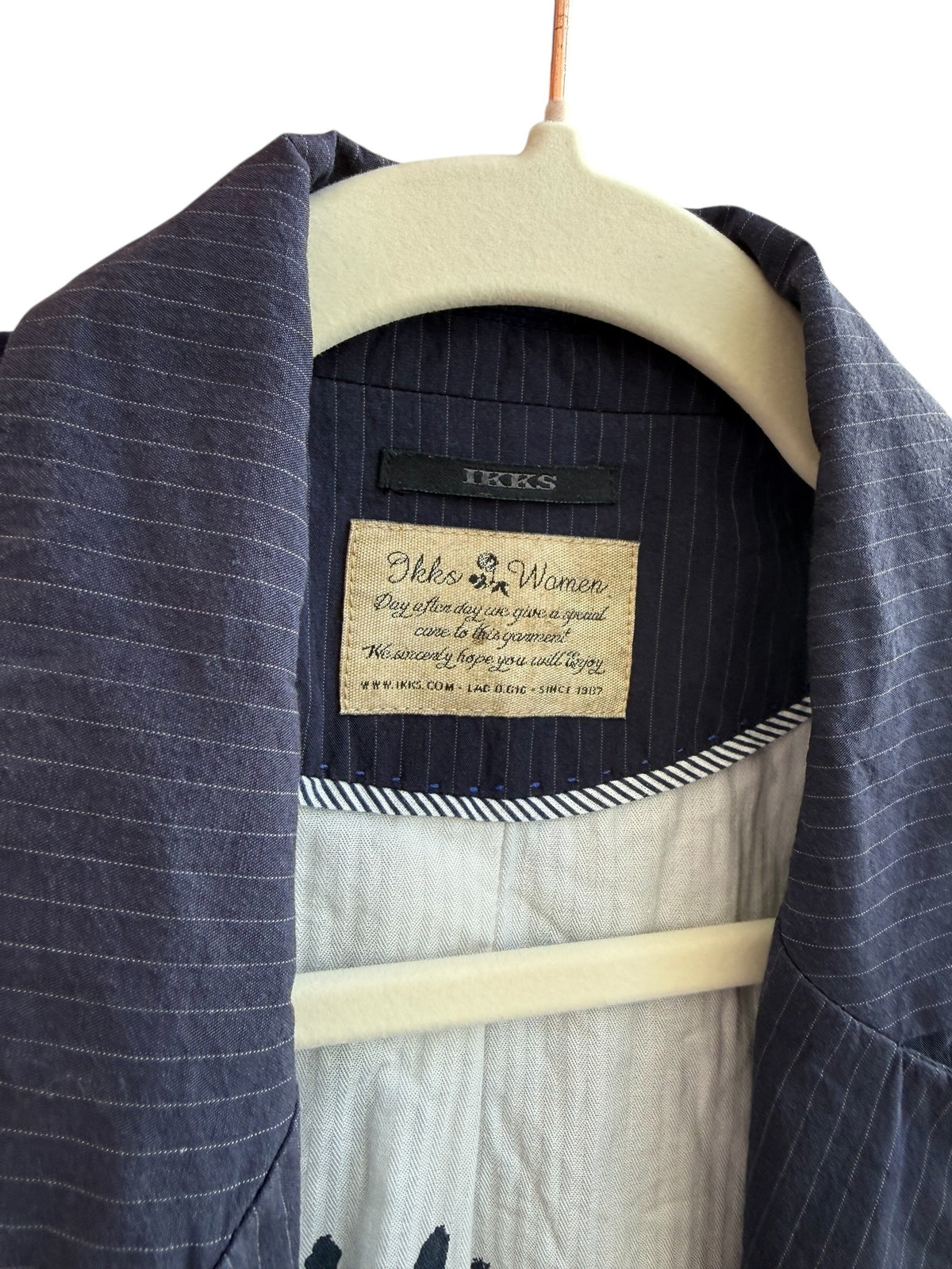 ReTrend navy blue pinstripe blazer with a tailored fit and button detail. Size 36.