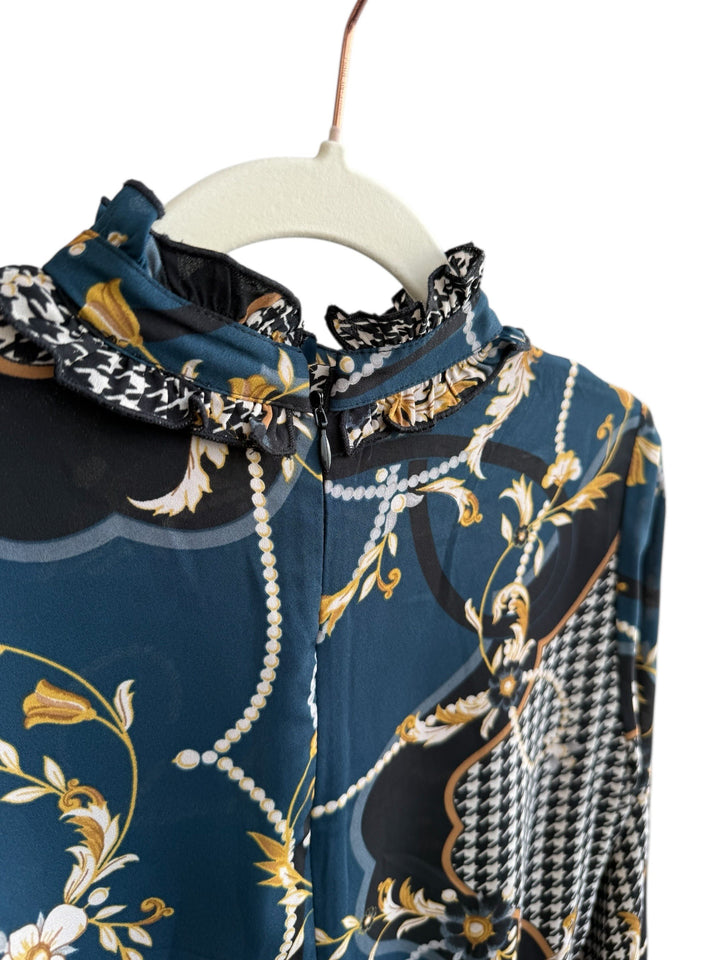 Retrend flowing dress size S, petrol blue with gold and black scarf print, ruffled mock neck, and elegant chain details.