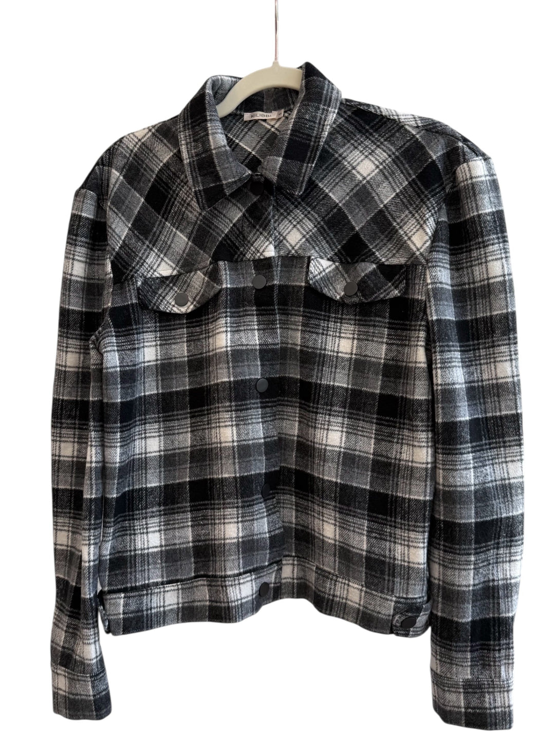 ReTrend black, grey, and ecru plaid overshirt with snap buttons and chest pockets. Size S.