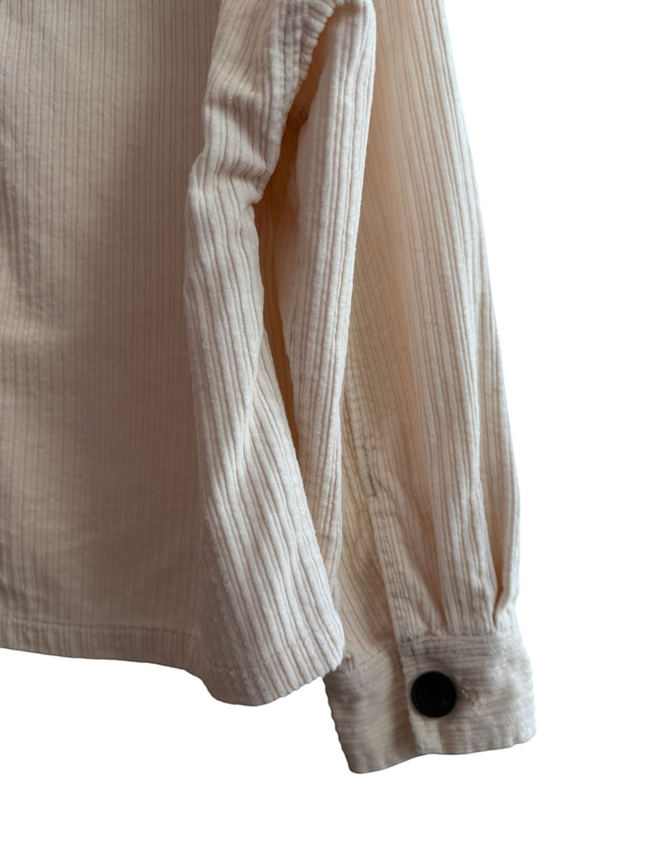 ReTrend beige corduroy jacket, size S, with a straight, slightly oversized fit, large chest pockets, and contrasting black buttons.