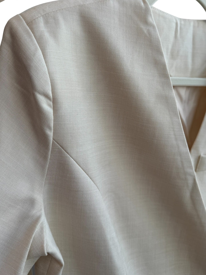 ReTrend beige fitted blazer with cross-over button closure, tie belt, and chest pocket. Size S.