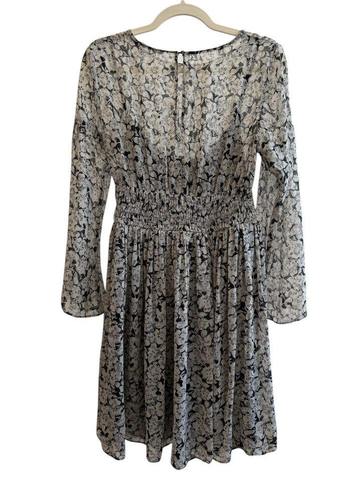 ReTrend black floral print midi dress with smocked waist, long sheer sleeves, and round neckline. Size M.