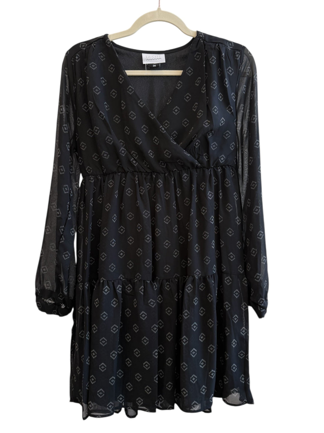 ReTrend black La City dress size 36, fluid fabric with discreet geometric print, cross neckline, long sheer sleeves, empire waist, tiered skirt.