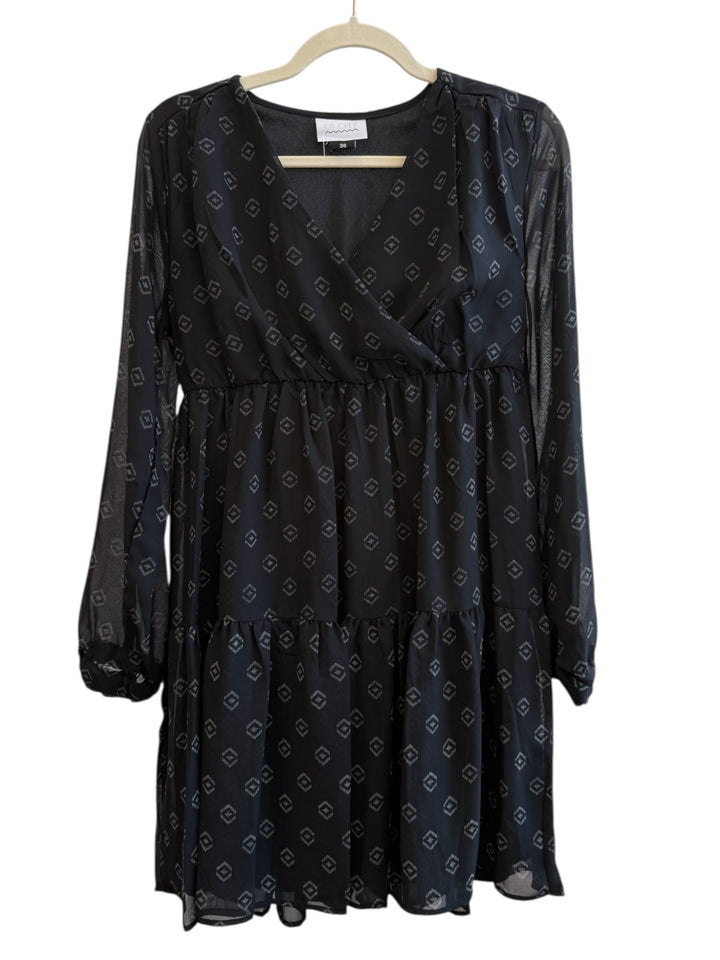 ReTrend black La City dress size 36, fluid fabric with discreet geometric print, cross neckline, long sheer sleeves, empire waist, tiered skirt.