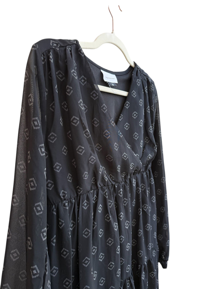 ReTrend black La City dress size 36, fluid fabric with subtle geometric print, V-neck, long sheer sleeves, empire waist, tiered skirt.
