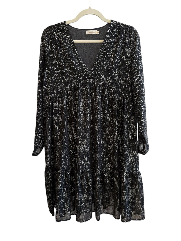 Retrend black flowy dress with subtle gold dotted print, V-neck, empire waist, long sleeves, and tiered hem. Size S/M.