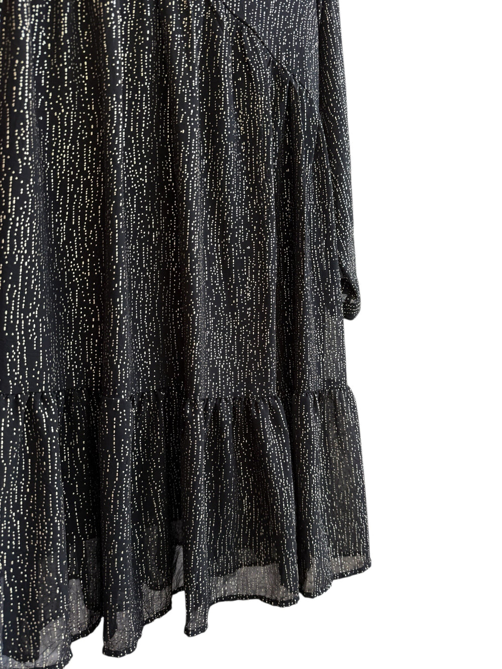 Retrend black fluid dress with subtle gold dotted print, V-neck, empire waist, long sleeves, and tiered hem.