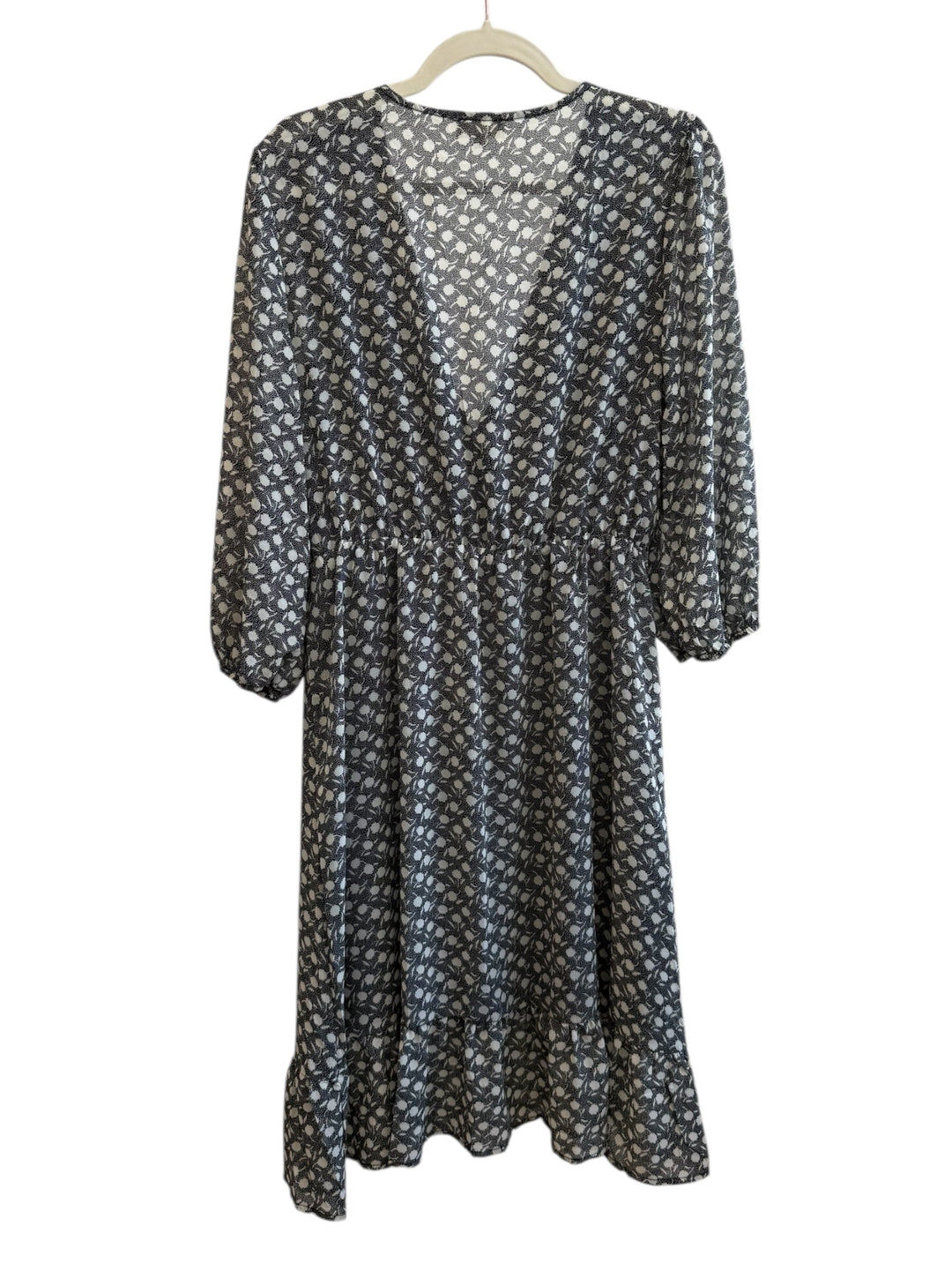 Retrend black and ecru graphic print midi dress with a wrap neckline, 3/4 sleeves, and ruffled hem. Size M.