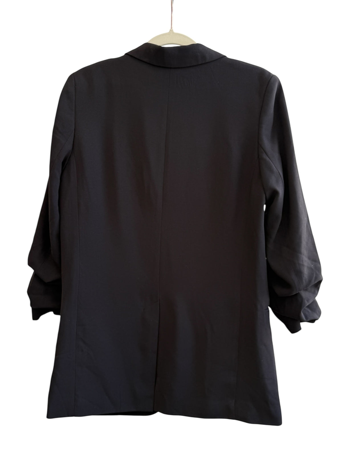 ReTrend black H&M oversized blazer with rolled sleeves, size 36. Features a single button closure, lapel collar, and flap pockets.