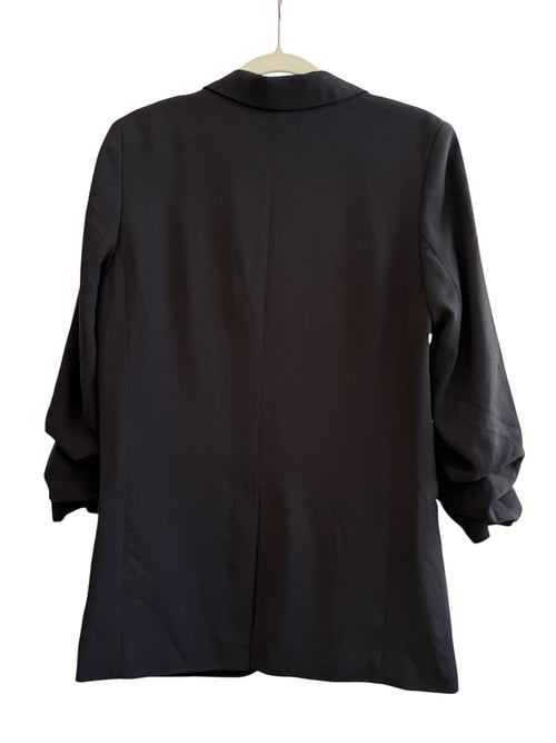 ReTrend black H&M oversized blazer with rolled sleeves, size 36. Features a single button closure, lapel collar, and flap pockets.