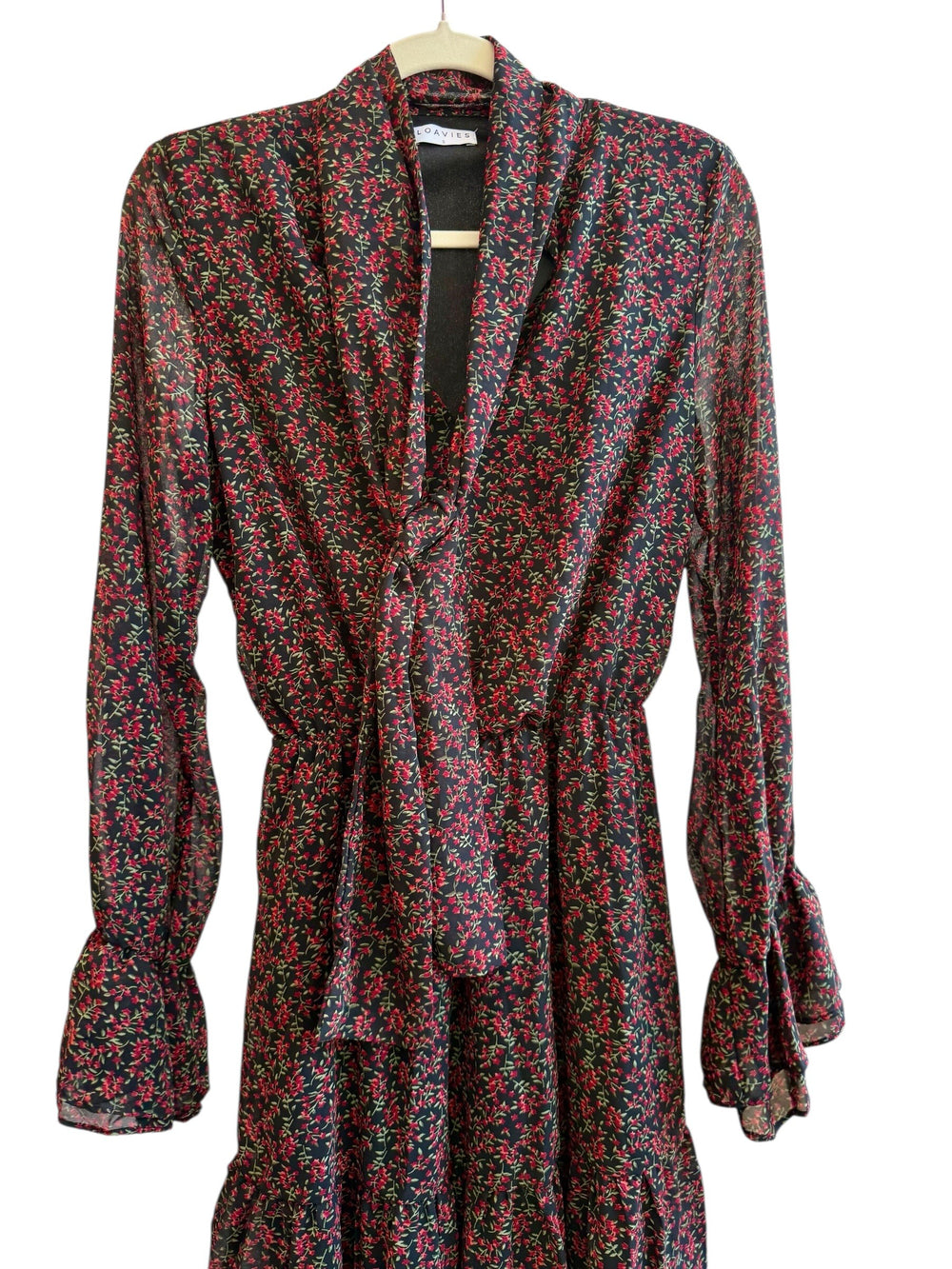 ReTrend black floral print midi dress with red flowers, V-neck, tie collar, long sheer sleeves, and ruffled cuffs. Size S.