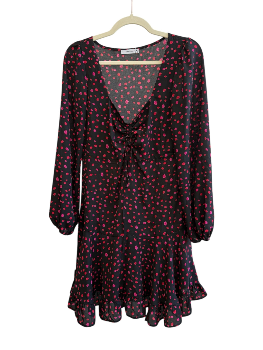 ReTrend black and red polka dot dress size 36. Flowy fabric with deep V-neck, tie detail, long sleeves, and ruffled hem.