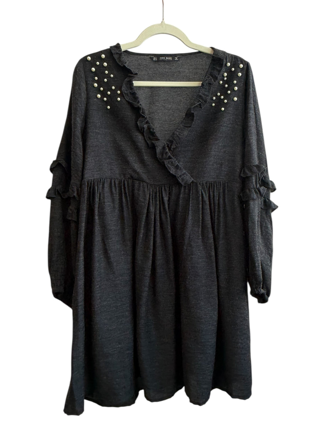 ReTrend Zara black fluid dress with ruffled V-neck, pearl details on shoulders, and ruffled cuffs. Size S.