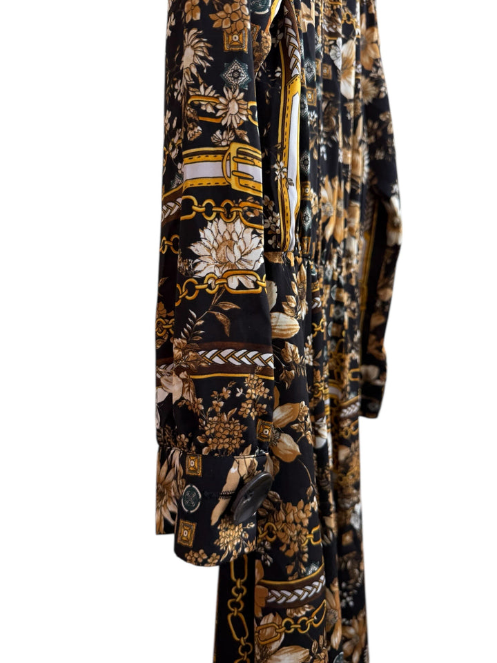 ReTrend black flowing midi dress size M with scarf print, chain and flower details, and button front closure.