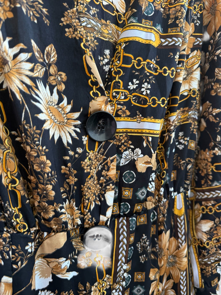 ReTrend black flowing midi dress size M with scarf print, chain, and floral details. Features button front and long sleeves.