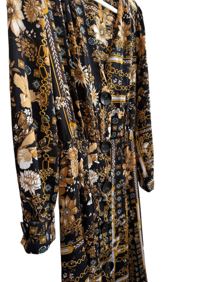 ReTrend black flowing midi dress size M with scarf print, chain and floral details, and button-front closure.