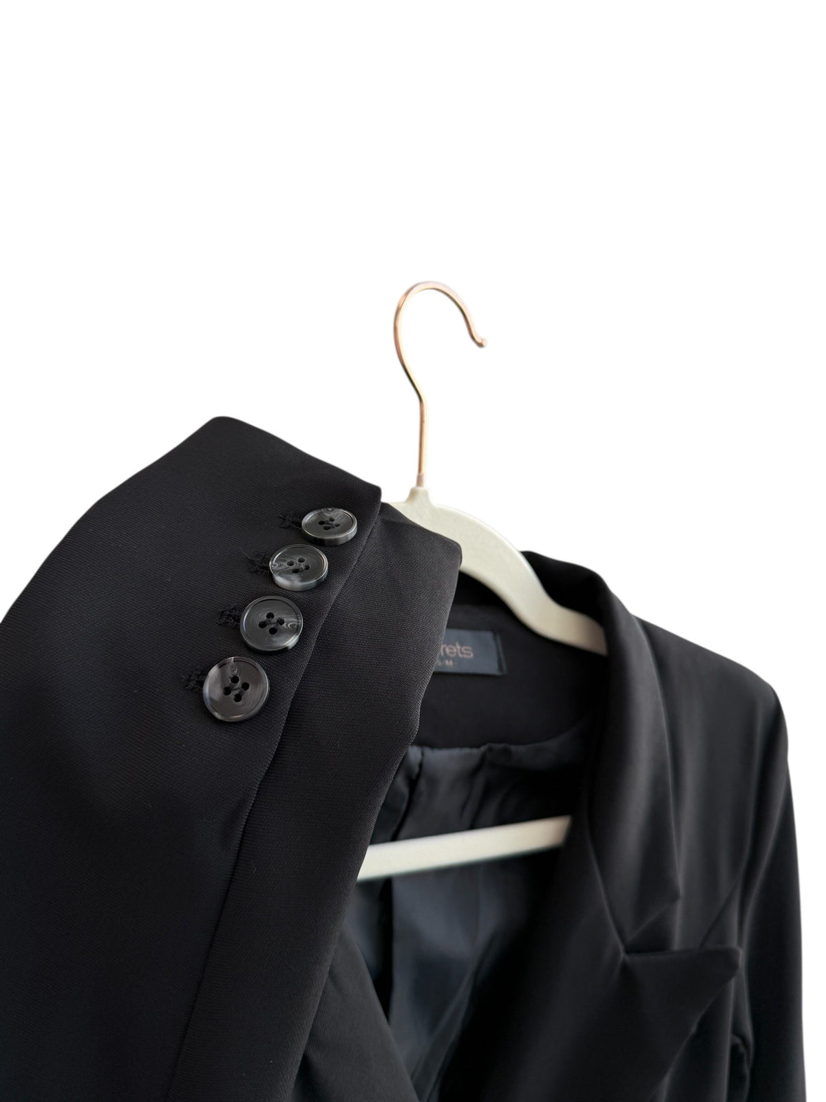 ReTrend black structured blazer with integrated belt, tailored fit, and decorative buttons on the sleeves. Size S.