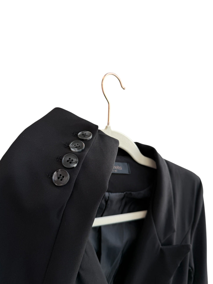 ReTrend black structured blazer with integrated belt, tailored fit, and decorative buttons on the sleeves. Size S.