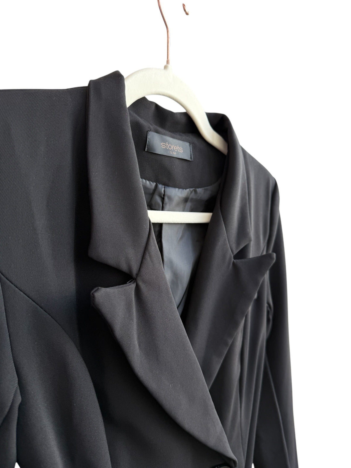 ReTrend black structured blazer with integrated belt, tailored fit, lapel collar, double-breasted, and decorative sleeve buttons. Size S.
