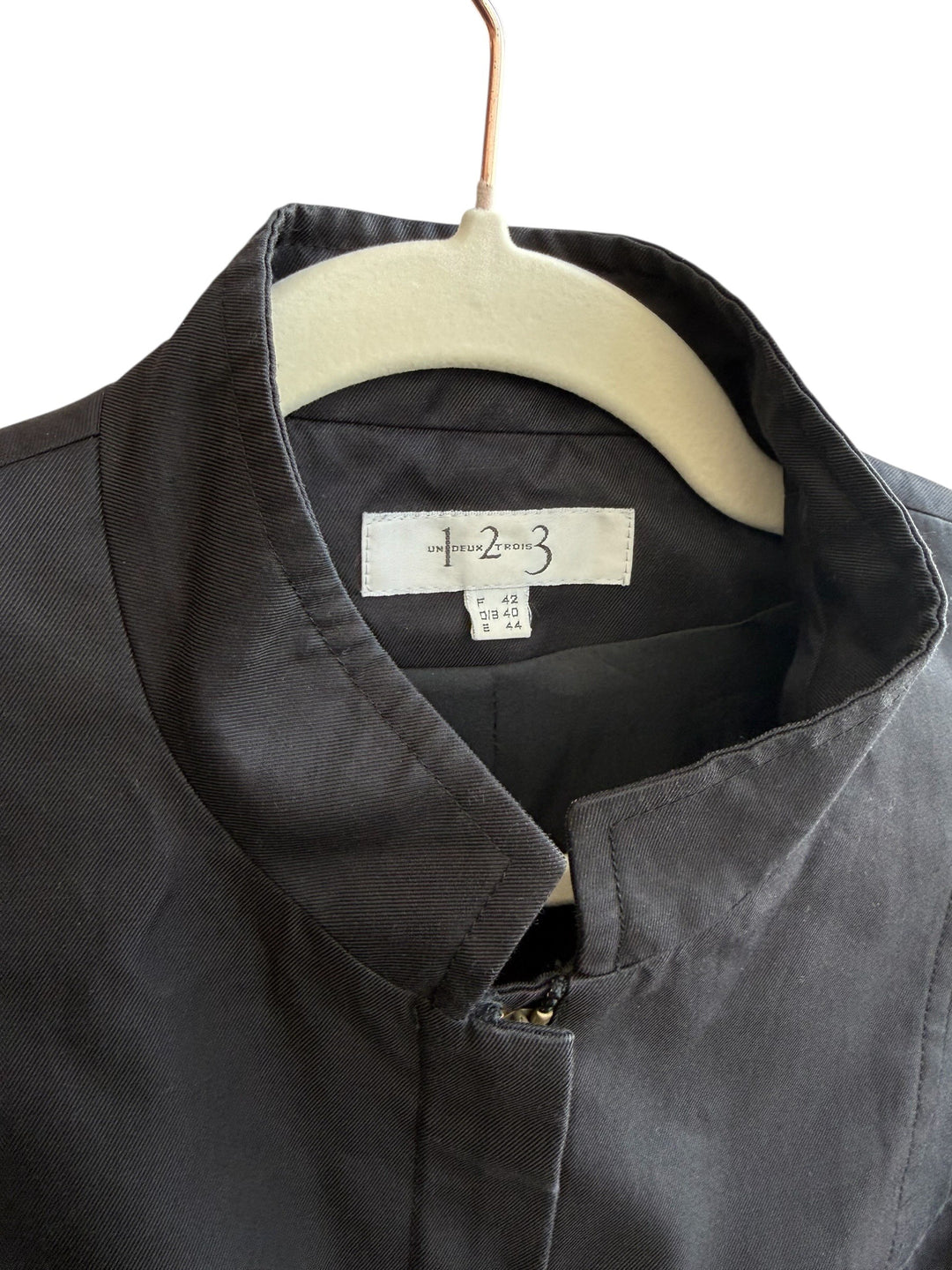 Retrend black structured twill jacket size 40 with stand-up collar, concealed closure, and waist belt.