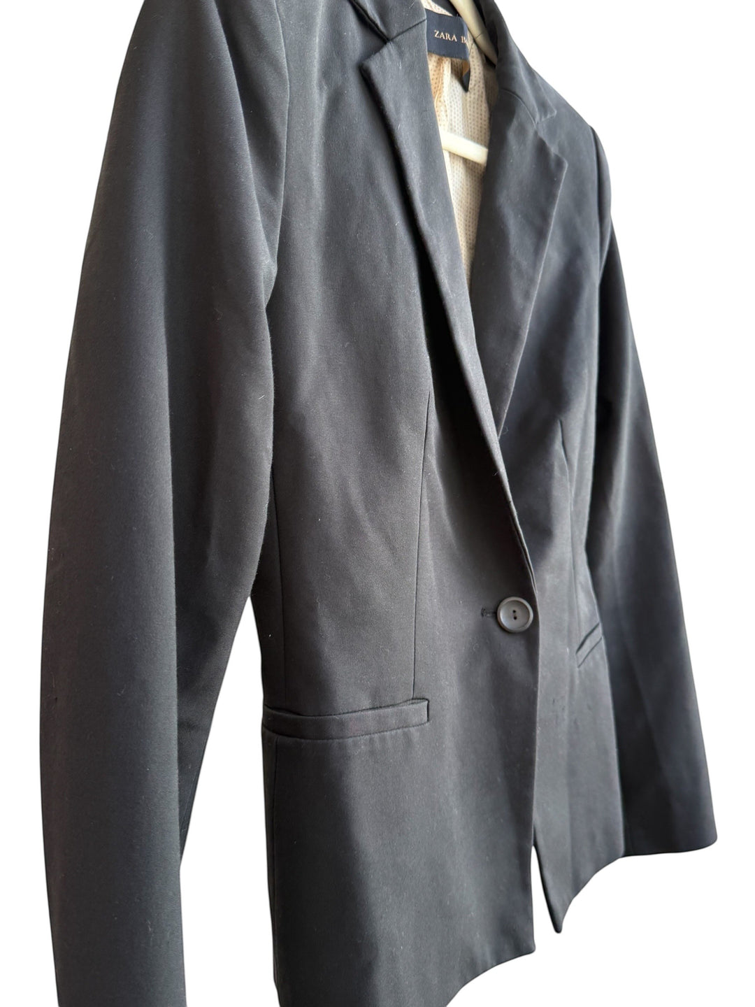 Retrend black Zara blazer, size M, with tailored collar, single button closure, and pockets. Lined in beige.