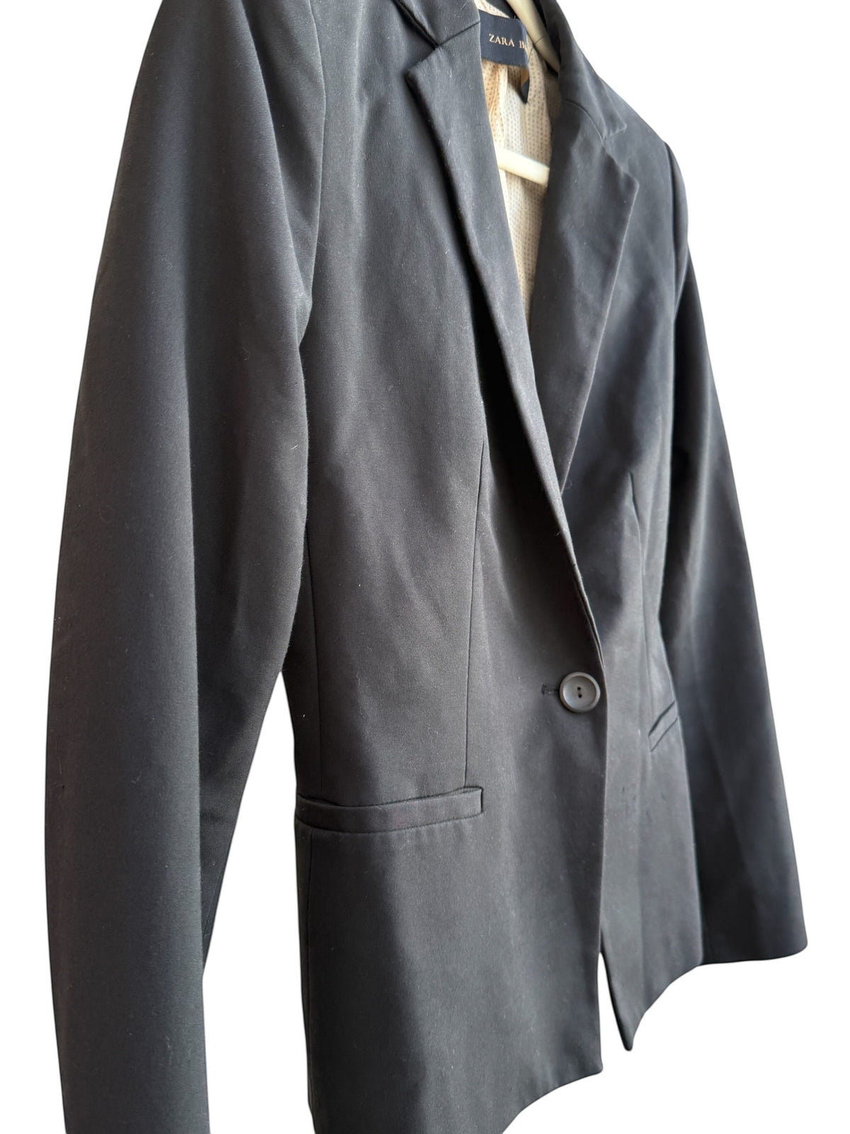 Retrend black Zara blazer, size M, with tailored collar, single button closure, and pockets. Lined in beige.