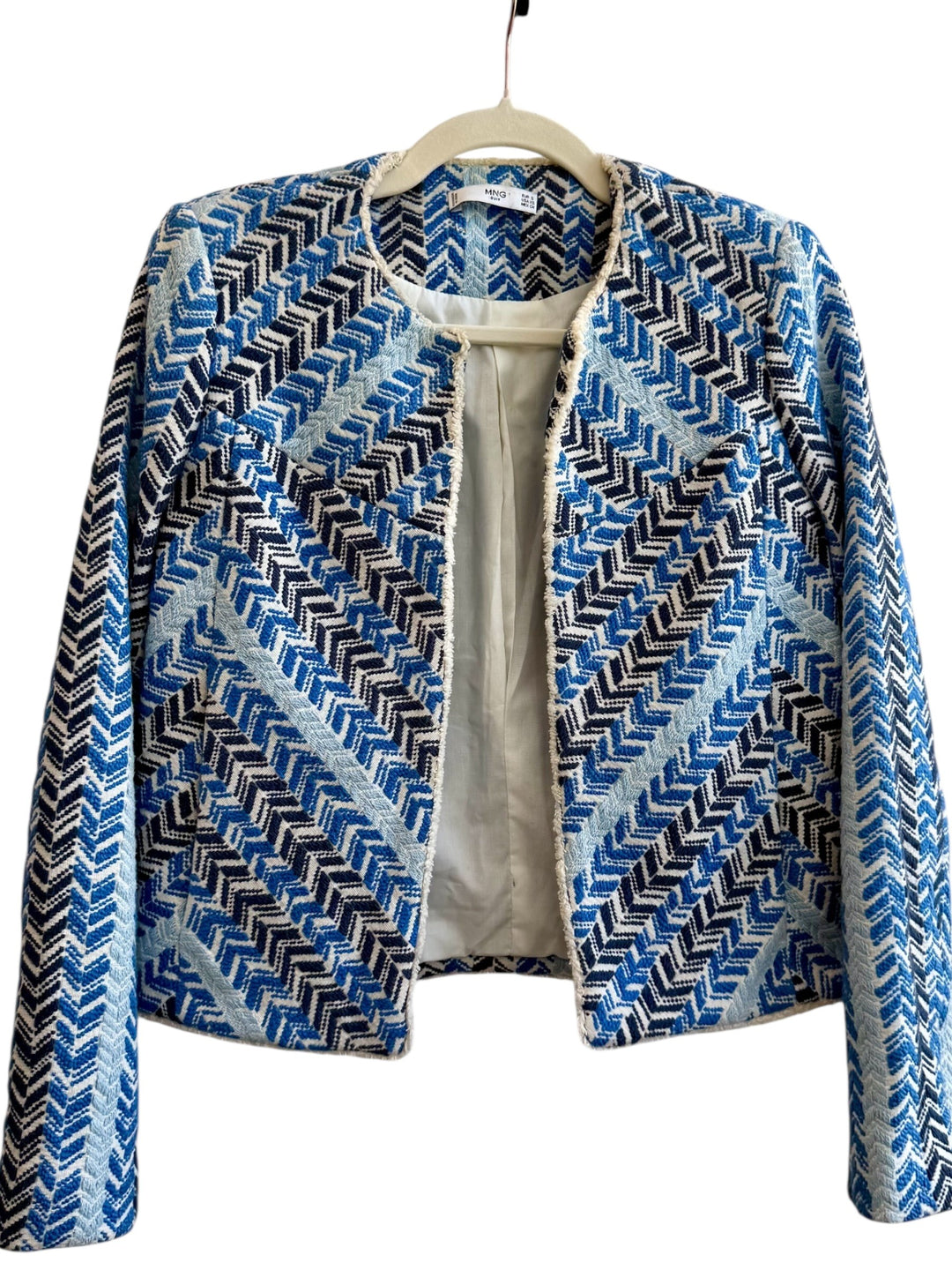 ReTrend short jacket in blue, white, and black chevron pattern. Textured cotton-linen blend with fringed trim.