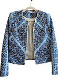 ReTrend short jacket in blue, white, and black chevron pattern. Textured cotton-linen blend with fringed trim.