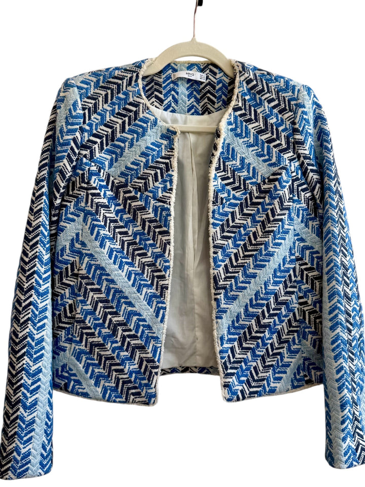 ReTrend short jacket in blue, white, and black chevron pattern. Textured cotton-linen blend with fringed trim.