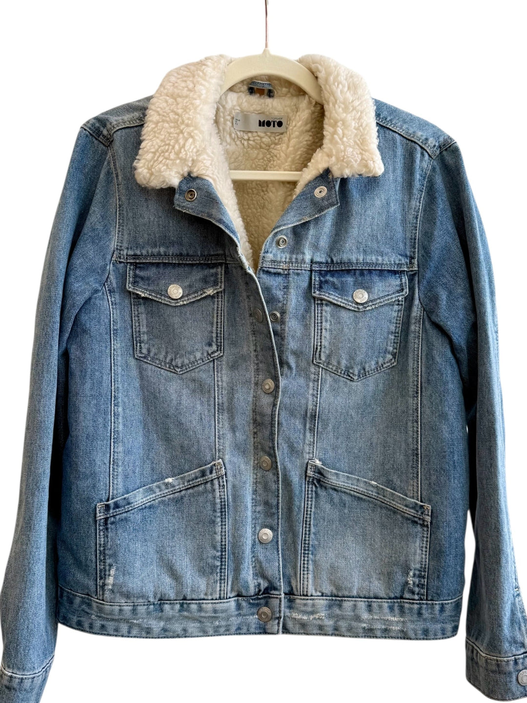 Retrend blue denim jacket with sherpa lining and collar, size 38, featuring button closure and chest pockets.