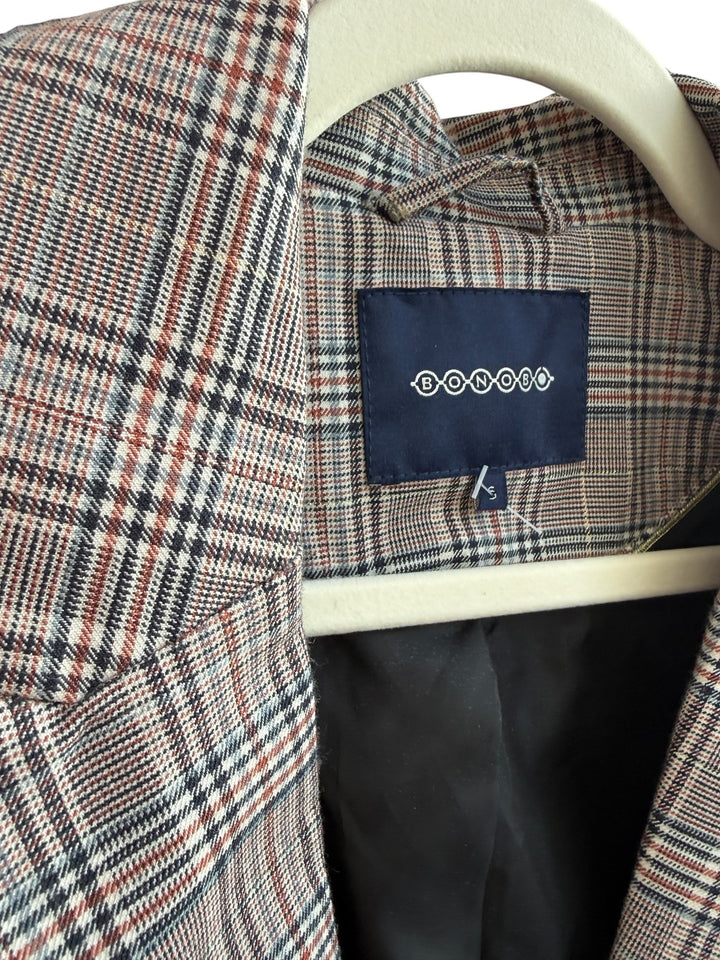 ReTrend Bonobo plaid blazer with roll-up sleeves and button closure, size S. Features a classic plaid pattern in brown, blue, and white.
