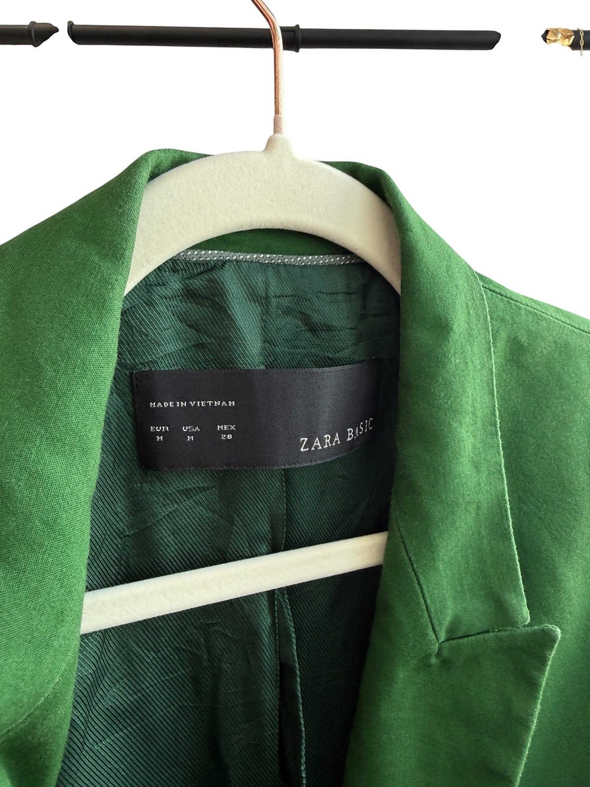 Retrend green Zara blazer, size M, with a tailored collar and single button closure. Features flap pockets and a satin lining.