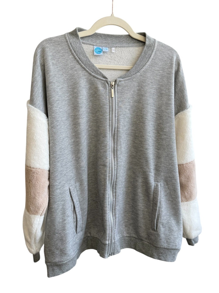 ReTrend grey zip-up sweatshirt with faux fur sleeves in white and blush pink, size S/M. Comfortable and casual.