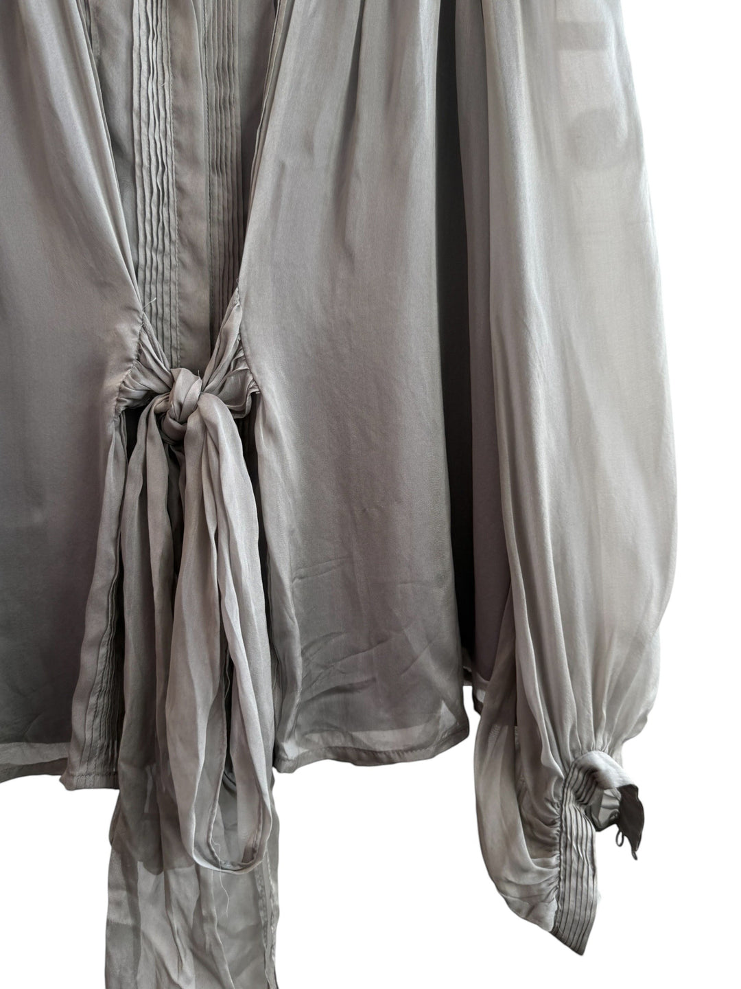 ReTrend grey silk blouse with fluid cut, pleated details, tie front, and puffed sleeves. Size M.
