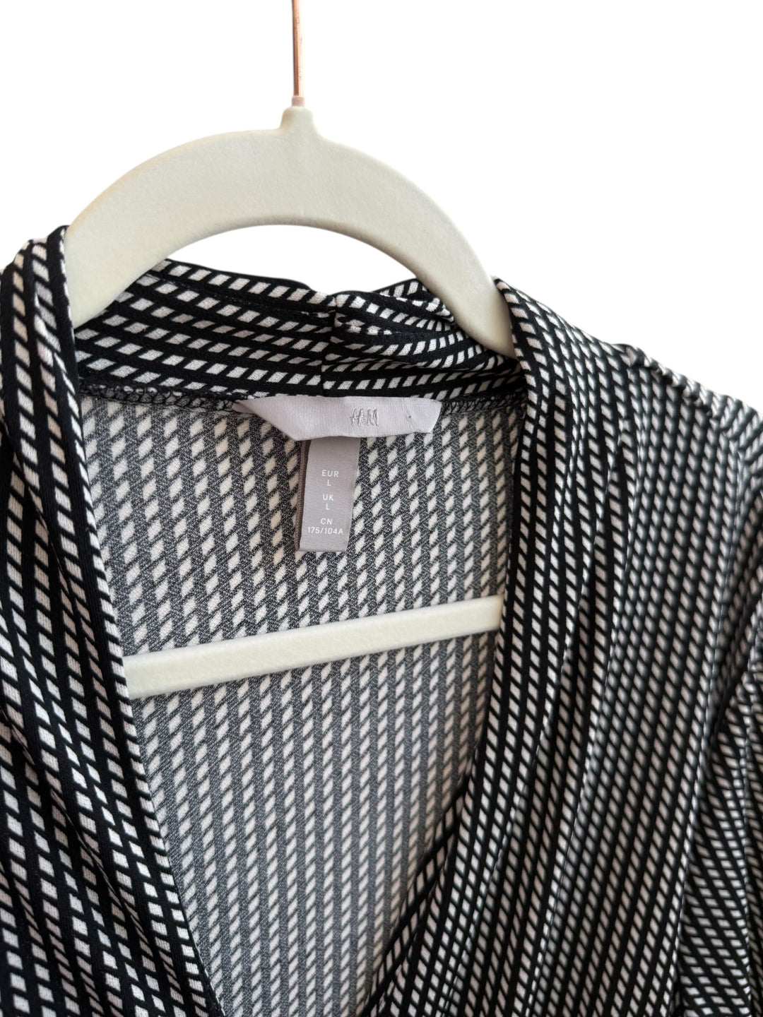 ReTrend black and ecru H&amp;M wrap dress size L with graphic print, V-neck, and tie waist.