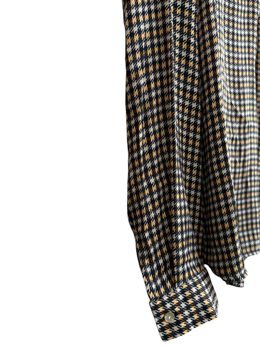 Retrend black, beige, and camel houndstooth print fluid blouse with a Tunisian collar and long sleeves.