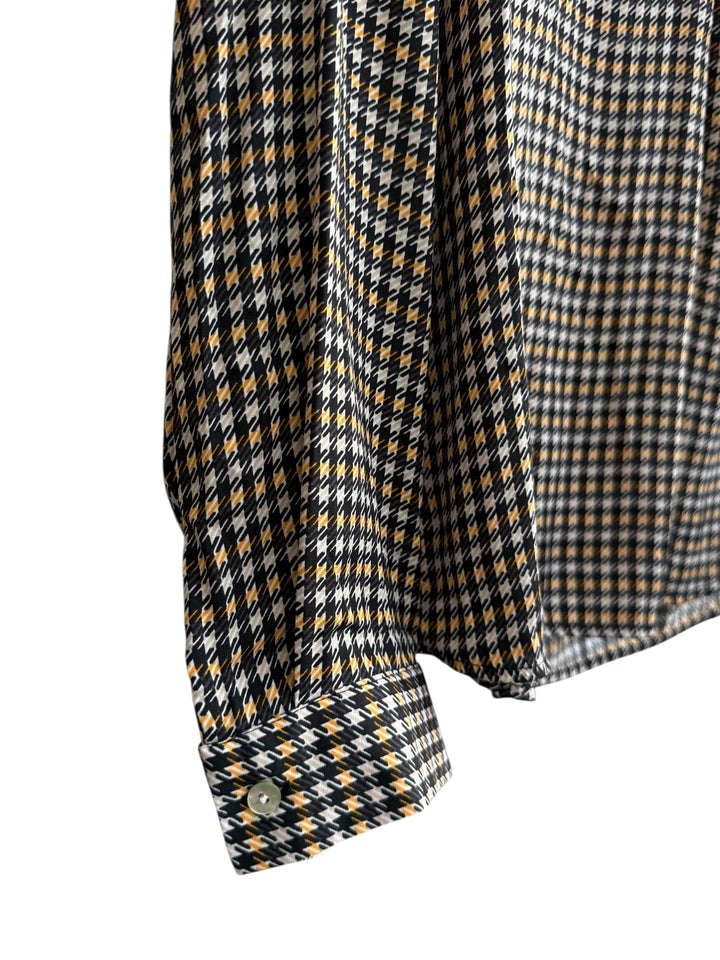 ReTrend black, beige, and camel houndstooth print fluid blouse with tunic collar and long sleeves.