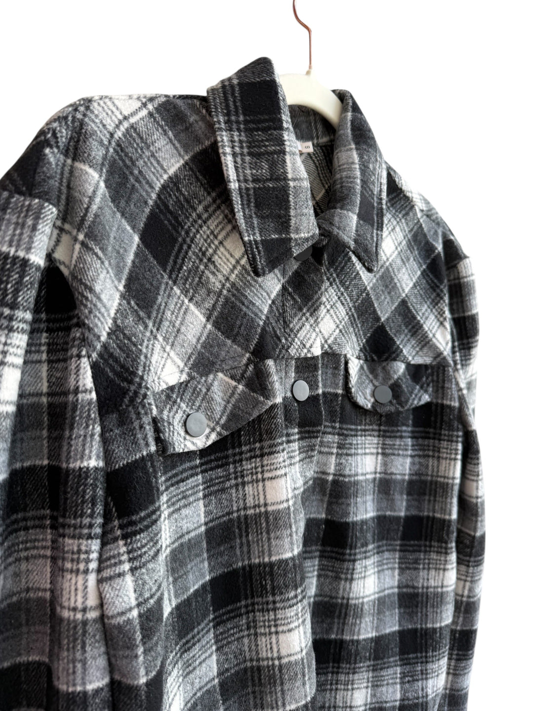 Retrend Kilibbi black, grey, and ecru plaid overshirt with snap buttons and chest pockets. Size S.