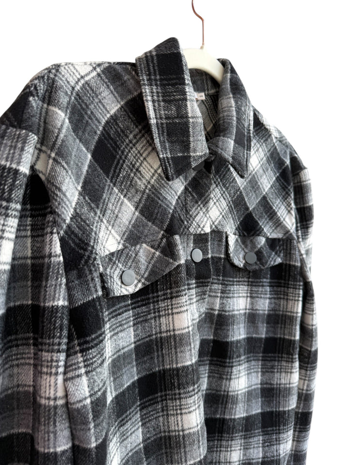 Retrend Kilibbi black, grey, and ecru plaid overshirt with snap buttons and chest pockets. Size S.