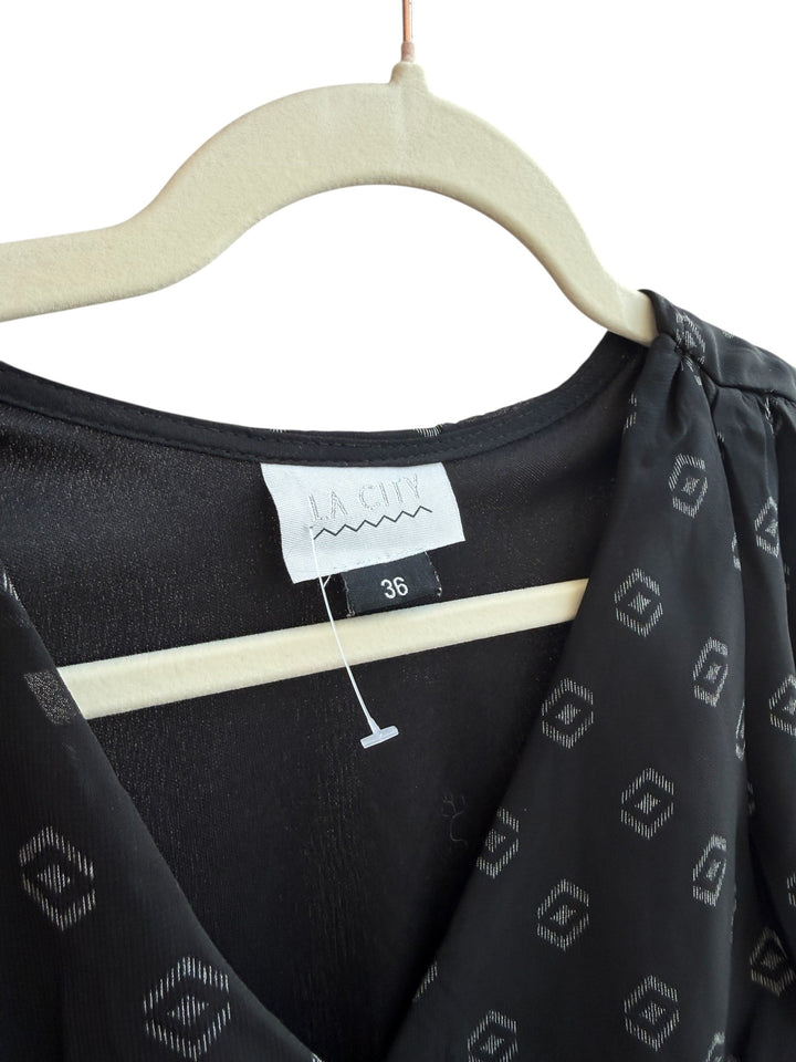 ReTrend La City black flowing dress size 36 with discreet geometric print, cross neckline and sheer long sleeves.