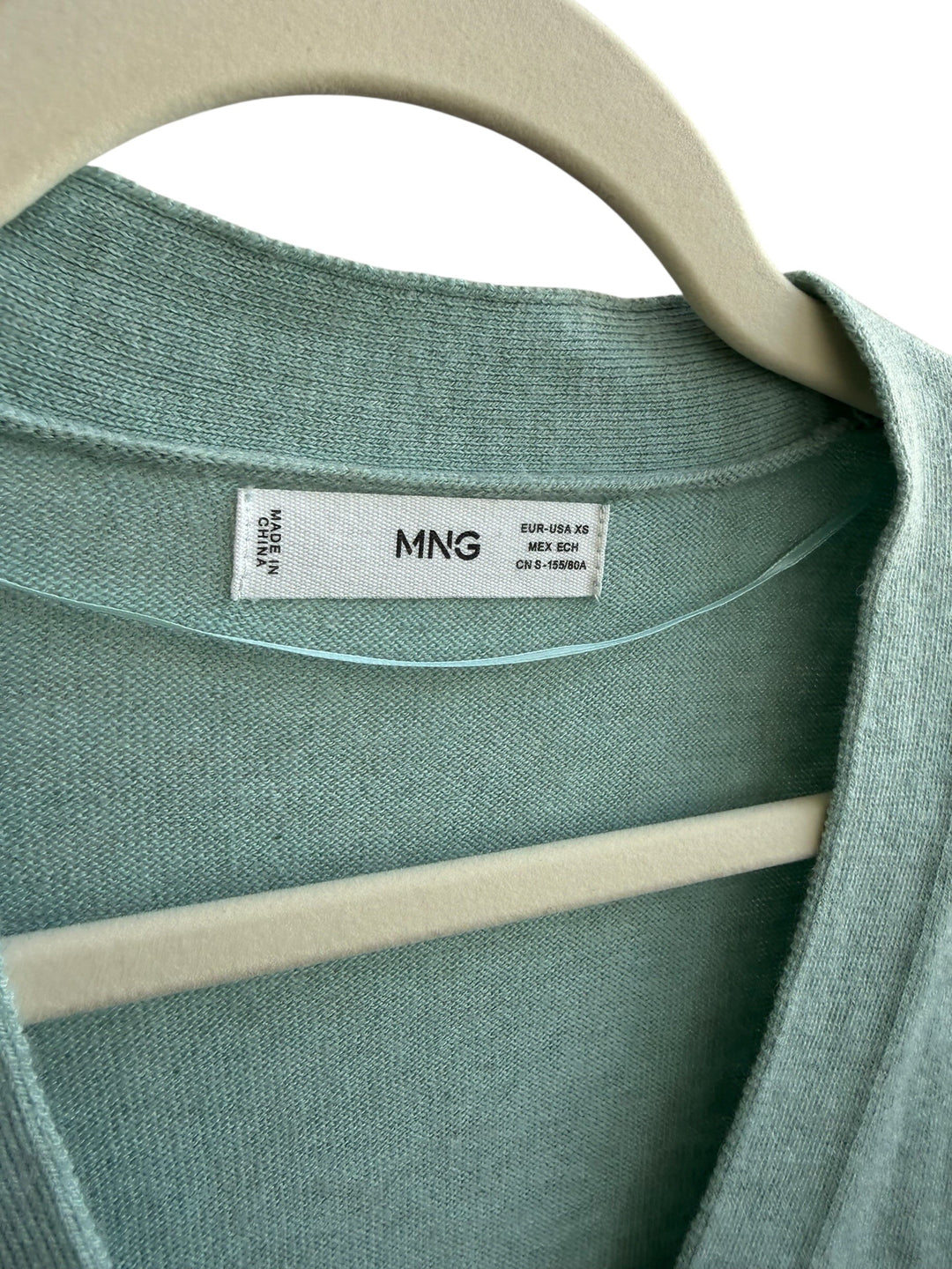 ReTrend light green V-neck fine knit cardigan with button closure, size XS.
