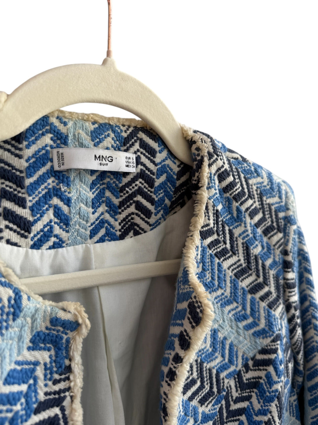 ReTrend Mango blue, white, and black chevron textured short jacket with fringed trim. Cotton-linen blend.